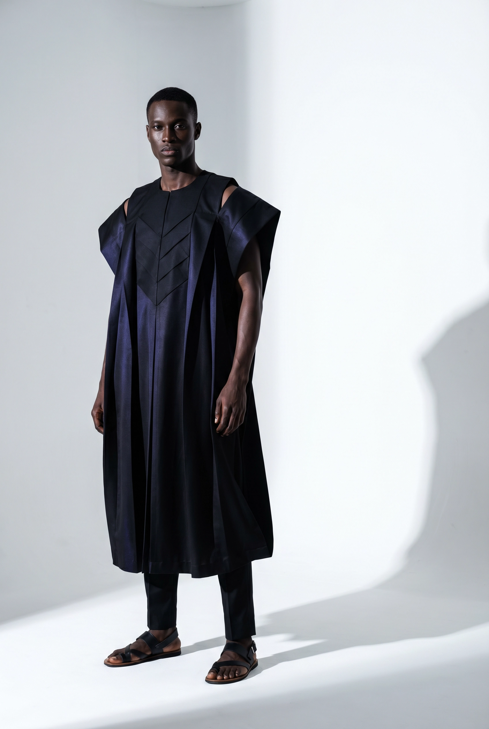 Navy structured agbada with geometric panel detailing — modern architectural silhouette